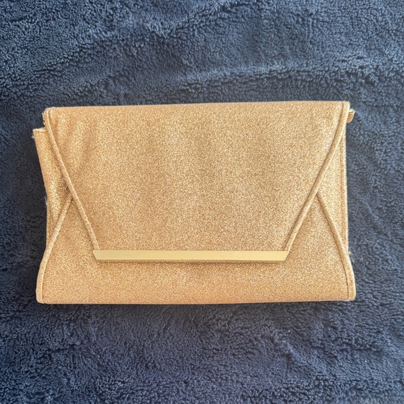 Aldo Handbags - Aldo Gold Glitter Envelope Clutch with Polished Bar Accent